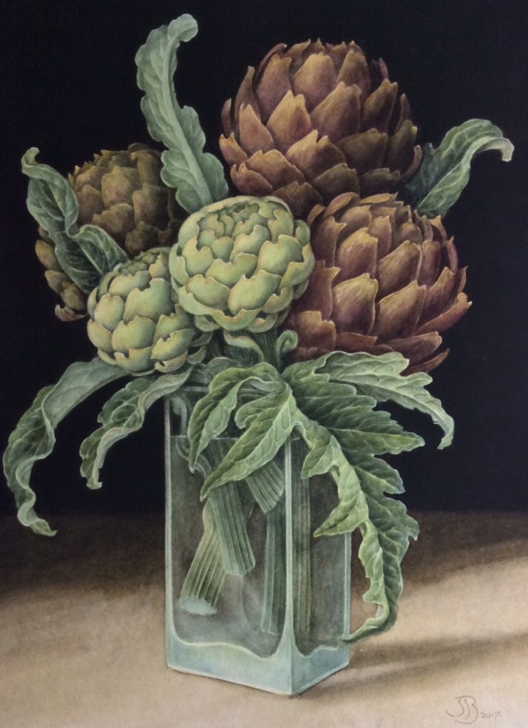 Five artichokes with stems arranged in a glass container with a black background