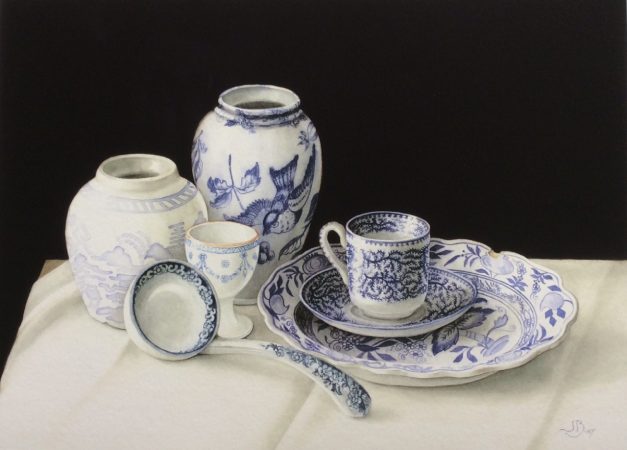 Collection of old blue and white Transferware china on a white cloth with black background. Giclee Print
