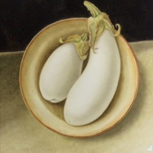 Two white aubergines /eggplants in a ceramic bowl