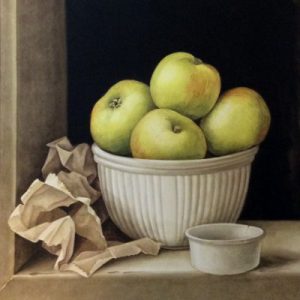 A bowl of green Bramley cooking apples and a crumpled brown paper bag
