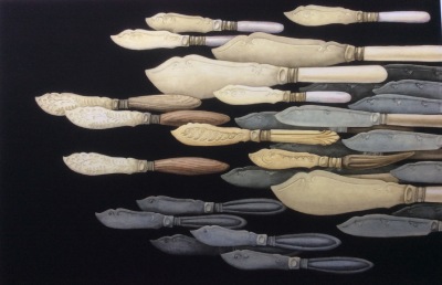 a clustered group of various antique fishknives imagined as a shoal of fish against a black background