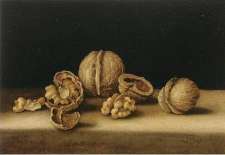 Small painting walnuts, thier shells and kernels on a black background